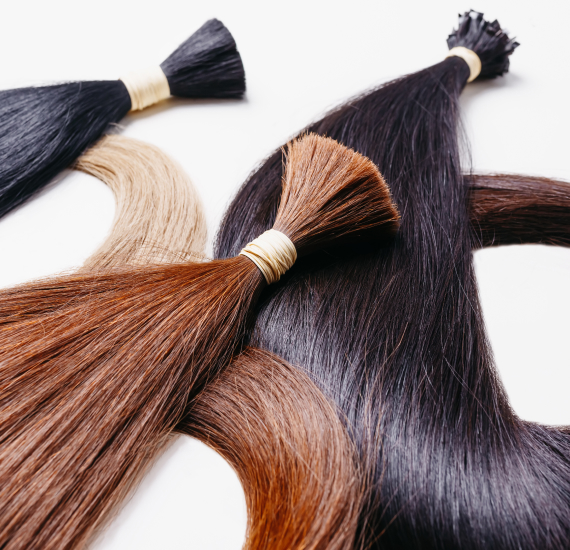 hair extensions of three colors on a white backgro 